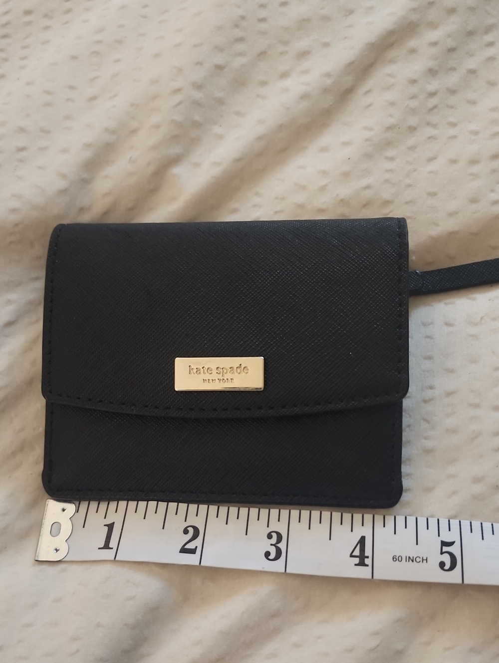 kate spade black saffiano leather wristlet wallet with gold plaque